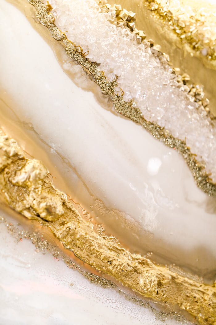 Sophisticated closeup of golden and white marble textures with glittery details, perfect for luxury design projects.